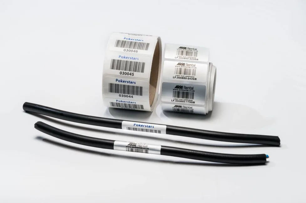 Serialised barcode AV equipment labels on rolls with labelled cable tails