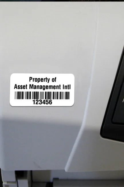 Serialised engineering asset label with barcode applied to industrial equipment