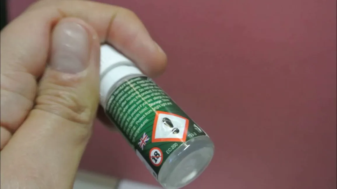 Tactile health warning labels — raised warning triangle applied next to a UN 3266 hazard marking
